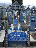 The tombstone of Stan Ioan Pătraş (1908–1977), the creator of Merry Cemetery