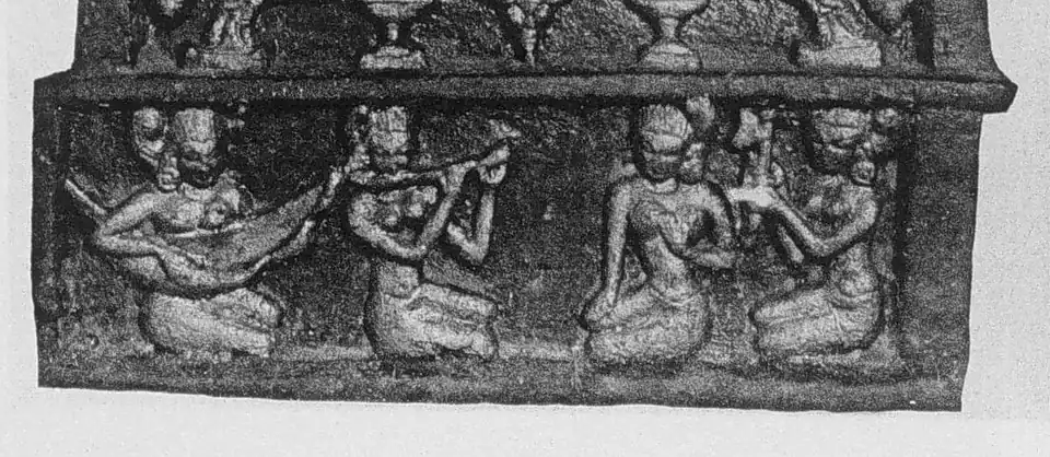 12th century A.D. sculpture from the Ananda Temple at Bagan, The women sing and play to the prince. From the left: harp, flute, singer, clapper.