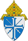 The arms of the Diocese of Lansing: The lances crossed per saltire are a play on the name of the see, the city of Lansing, Michigan.[7]