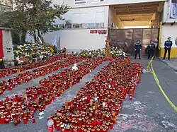 Main entrance of the former factory, guarded by policemen