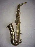 Left side view of Conn 6M "Lady Face" alto saxophone showing distinctive underslung octave key