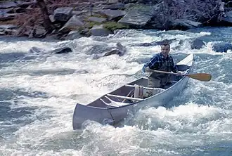 Corny King canoeing on Tenmile River, Apr 29, 1951, on an Appalachian Mountain Club trip.