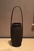 Flower basket (hanakago). Purple smoked timber bamboo, rattan, and lacquer. By Iizuka Hōsai II, Shōwa period, c. 1924–1934