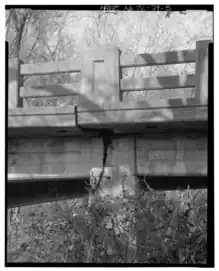South exposure detail showing chamfered corners and incised panels
