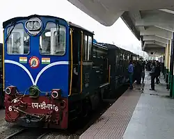 Blue diesel train at a station