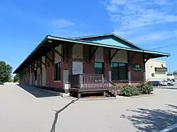 A single story building, showing railroad influence in its design. It is no longer next to railroad tracks but maintains its original design.