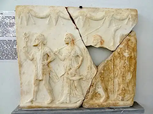 Ancient Greek bucrania with festoons on a relief with Hermes, Athena, Apollo and Artemis, 125-100 BC, marble, Archaeological Museum of Delos, Delos, Greece