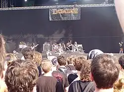 Distant photograph of a band on stage