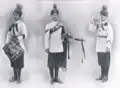 Drummer, Piper, and Bugler. L to R: Drummer Ali Gaur, Pipe Major Sarwar Khan, Bugler Sardar Ali.[28]