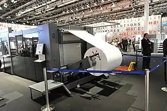 The paper on a roll can be printed in sheetfed offset using a roll sheeter.