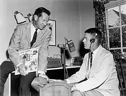 Jim Copp (right) in his home recording studio with Ed Brown, holding a copy of Jim Copp Tales