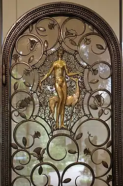 Art Deco volutes on a pair of elevator doors, by Edgar Brandt, 1926, wrought iron, glass, and patinated and gilded bronze, Calouste Gulbenkian Museum, Lisbon[14]