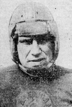 Black-and-white portrait of Emil Beasy, a then young white man wearing a jeryse and a football helmet.