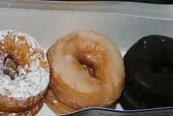 Powdered, glazed and chocolate doughnuts from a variety pack sold at supermarkets