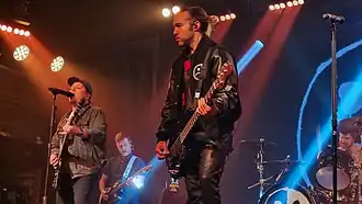 Fall Out Boy performing at Heaven, London in 2023. (L–R) Patrick Stump, touring musician Ben Young, Pete Wentz, and Andy Hurley.