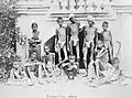 Famine in India; a group of emaciated young men wearing loin Wellcome