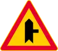 Junction with a minor road (formerly used )