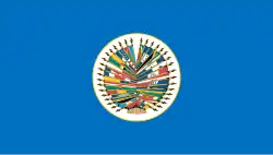 Seal of the Organization of American States on a blue background.
