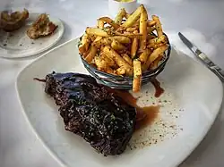 Steak frites prepared using flank steak, at a San Francisco, California restaurant