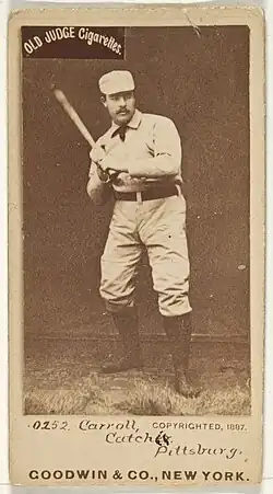 Man standing holding baseball bat