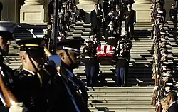 Honor guards carry the casket of former President Gerald R. Ford out of the United States Capitol Building in Washington, D.C., January 2, 2007 en route to Washington's National Cathedral for a funeral service.