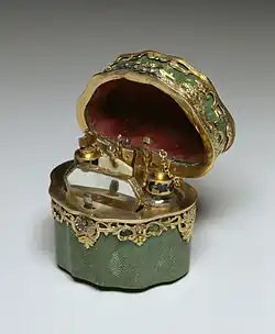German, Toilet Case, c. 1750, "contains two glass scent bottles, a mirror, a folding ivory writing tablet, a gold bodkin, two gold toothpicks, and a miniature pair of gold tweezers".