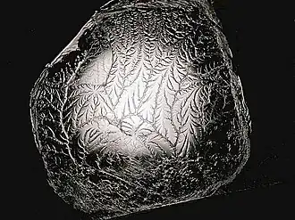 A fractal is formed when pulling apart two glue-covered acrylic sheets