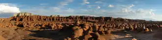 hundreds of sandstone hoodoos protruding from the desert floor.