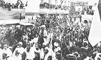 The emperor entering Tangier on horseback, surrounded by his escort.