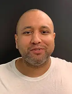 Headshot of Mahdi on a gray background