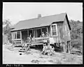Children on porch of home of Black miners in company housing project, 1946