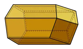 A diagram showing the 3D structure of a honeycomb cell, consisting of a hexagonal face on the left hand side connected to three rhombic faces on the right by six flat quadrilateral surfaces