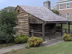 Log cabin in downtown Monticello, Kentucky, built in the early 19th century by "Raccoon" John Smith (1784–1868). The cabin was originally located in Horse Hollow on the Little South Fork River.