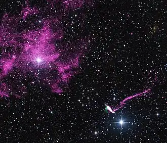 Composite image of IGR J11014−6103 and MSH 11−61A that contains data from NASA's Chandra X-ray Observatory (purple), radio data from the Australia Compact Telescope Array (green), and optical data from the 2MASS survey (red, green, and blue)