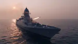 INS Surat, firing rockets.