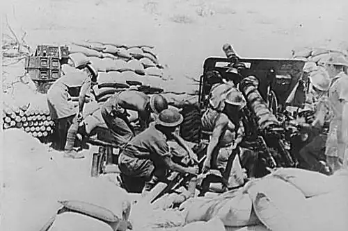Indian Ordnance QF 18-pounder gun crew in action before capture of Keren