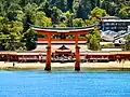 Itsukushima shrine taken from water with gate (tori) in foreground
