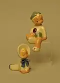 Jane Fauntz baby and sitting boy figurines.