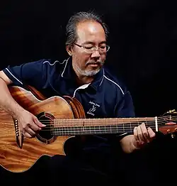 Jeffrey Yong playing the Seismic 10-string guitar