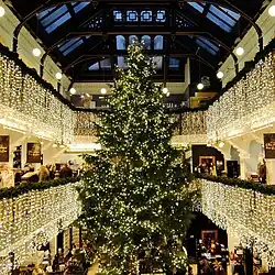 decorated 100-foot Christmas tree inside the gran hall