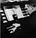 Jörg Mager playing his organ, c. 1938, photographer unknown, PIX Magazine[8]