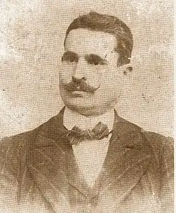 Portrait photograph of José Sánchez Rosa, wearing a moustache and a suit