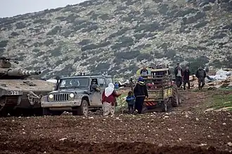Israeli tank training in the fields of Khirbet Ibziq Palestinian village, forcing residents to leave their homes, December 2021