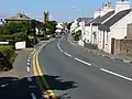 The main A3 road leading through Kirk Michael village after Douglas Road Corner