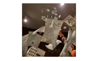 Koch snowflakes descend through the Cavalcade of mathematical pages onto Integral Hill in the exhibit