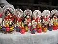 Some finished mini idols of Devi lakshmi, Ganesha, Jagannath, Balarama and Subhadra are on sale at Kumortuli