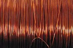 Copper bars stacked in an LME-approved warehouse, symbolizing global copper trading and storage.