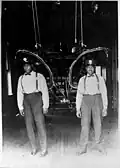 Firemen Lawrence Washington and Andrias Davis stand inside Engine Company No. 30, Los Angeles Fire Department, 1913
