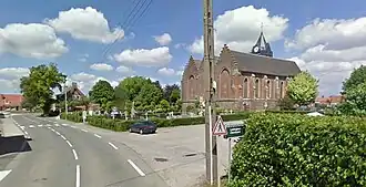 View of Ledringhem church, graveyard and town hall