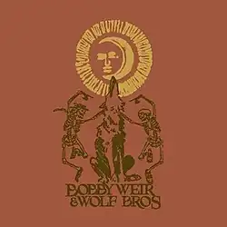 Two dancing skeletons, and a wolf howling at the moon